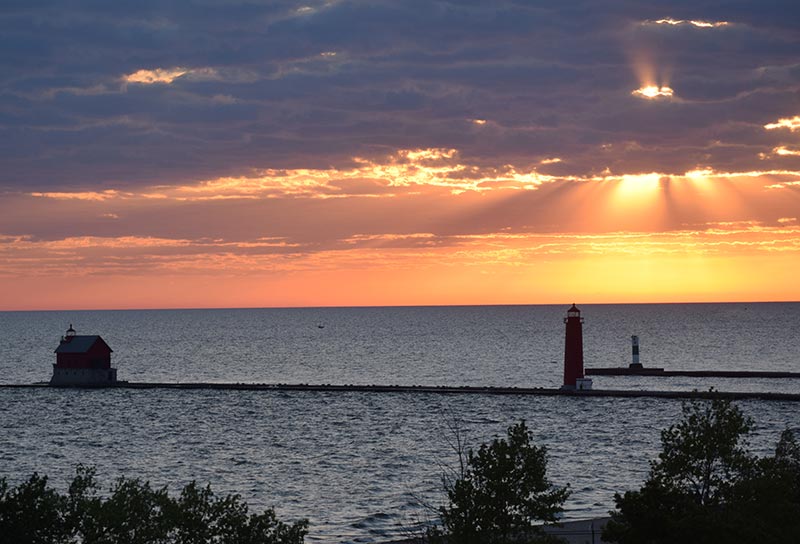 Sunset, Looking Glass Beachfront Inn Grand Haven, Michigan Beachfront Inn pier lighthouse